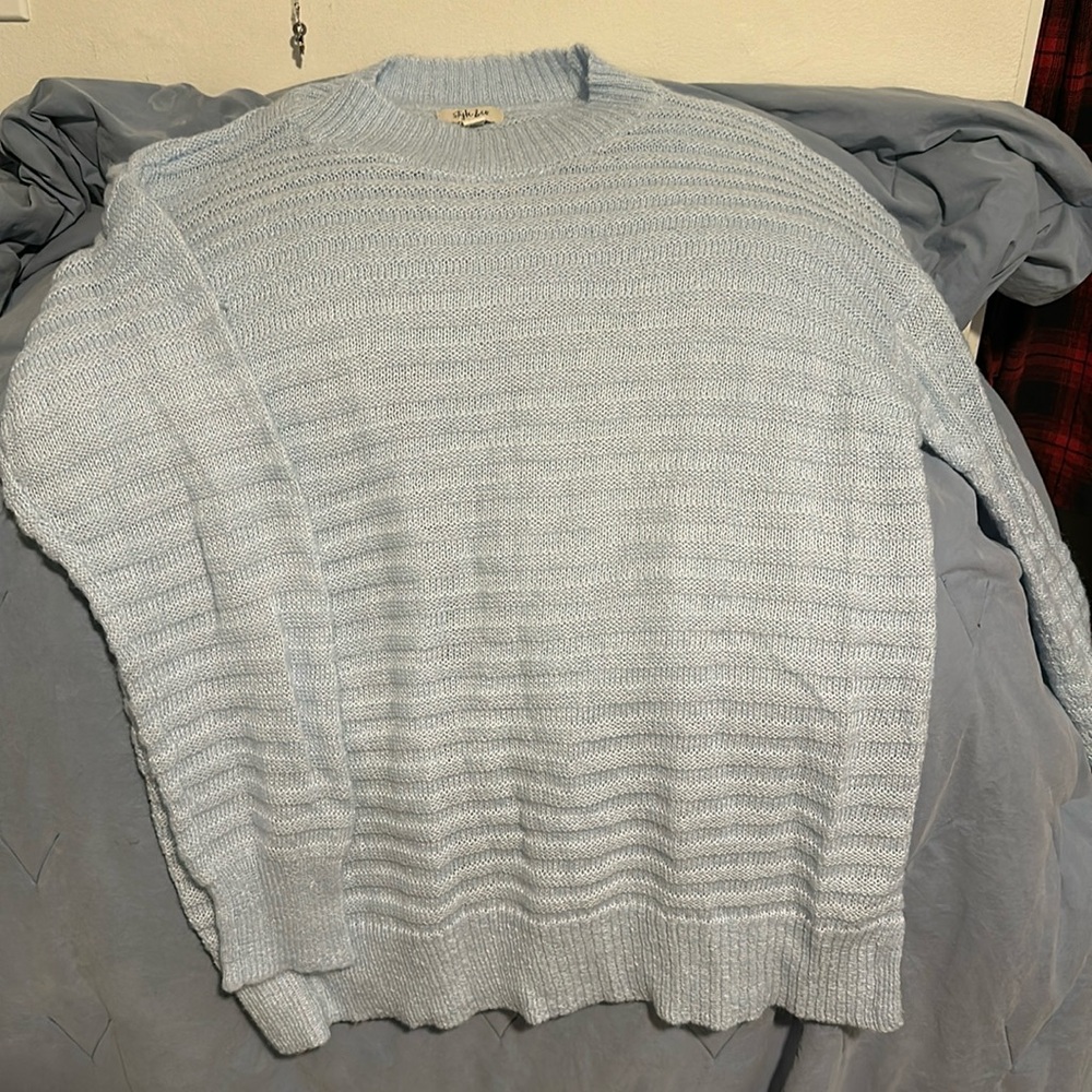 Very soft and comfortable light blue sweater, cardigan style.